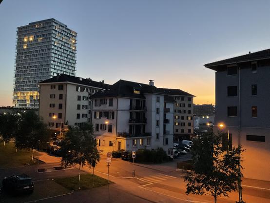 Urban landscape in the dusk, most notably the Tilia Tower in Prilly.