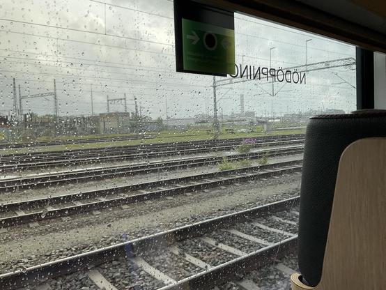 View from the train, raindrops on the windows.